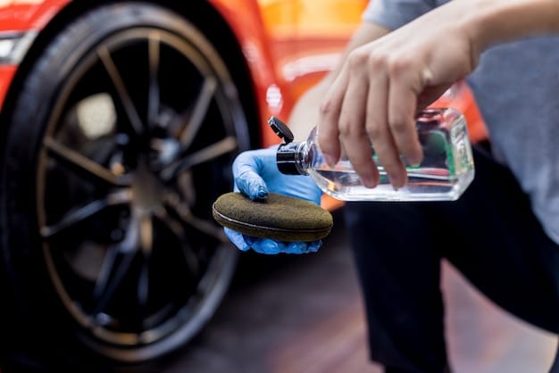 A person applying tire shine gel to a clean tire using an applicator pad, showcasing the application process and the glossy finish of the gel.