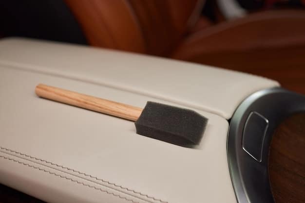 An array of leather cleaning and conditioning products displayed neatly on a car seat, alongside microfiber cloths and a soft brush.