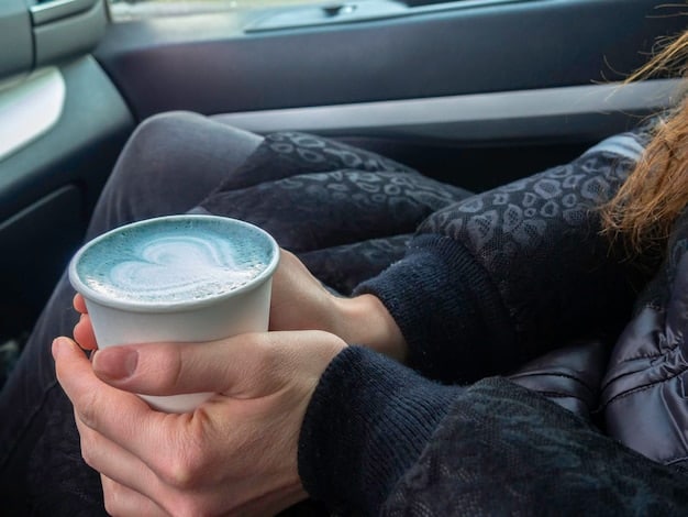 A close-up shot inside a car depicting spilled coffee on the floor mat, highlighting a common source of car odors