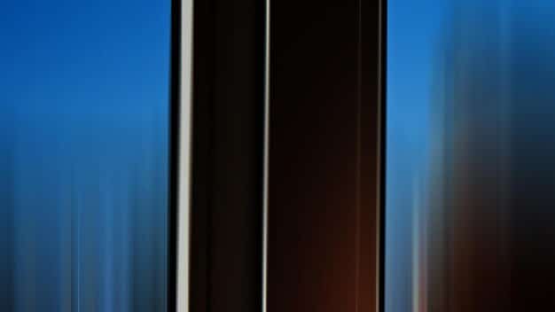 A close-up of various window tint films with different darkness levels, displayed against a clear background to show their varying light transmission properties.