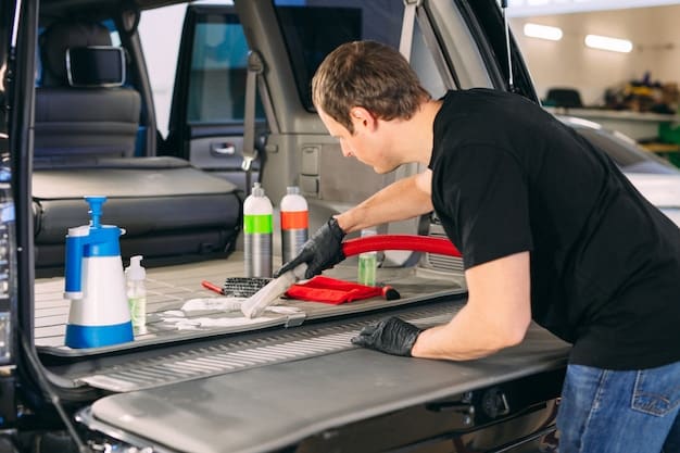 A person organizing a car care kit in a toolbox, wearing gloves and carefully placing various cleaning products and tools, with a focus on the action and precision of organizing.