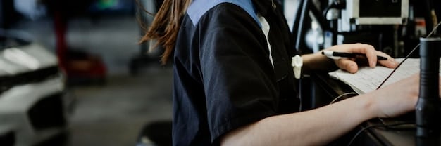 A car being serviced in a modern auto shop, with mechanics working on different parts of the vehicle, showcasing the comprehensive services available.