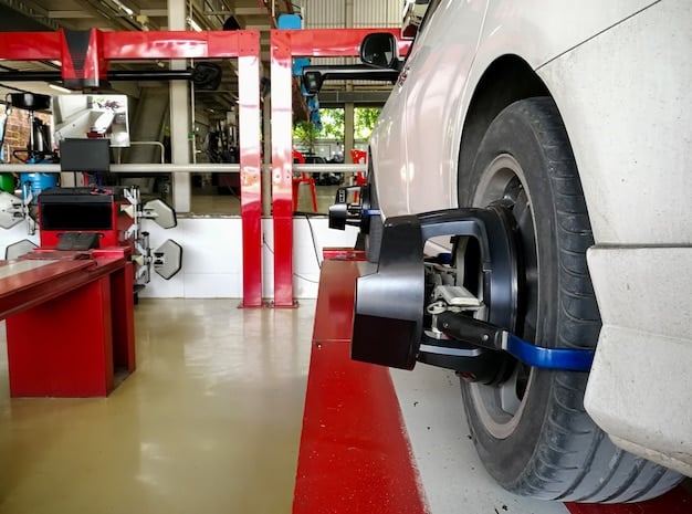 A vehicle undergoing wheel alignment in a modern auto shop, with laser alignment tools visible and a technician carefully making adjustments, highlighting the precision of professional alignment services.