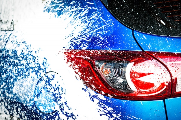 A split image showing a car's paint before paint correction (swirl marks visible) and after paint correction (flawless, mirror-like finish). The contrast highlights the dramatic improvement achieved through the service.