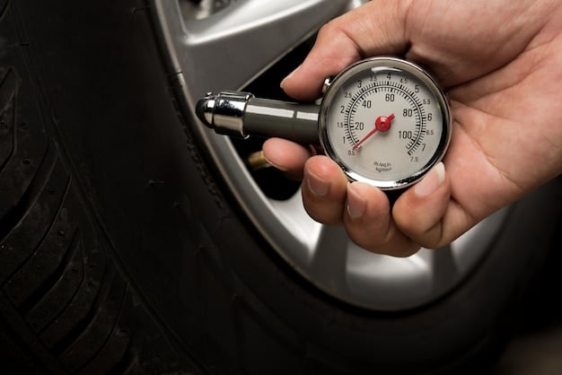 A close-up shot of a mechanic checking the tread depth on a car tire using a tread depth gauge. The lighting highlights the tire's texture and the gauge's markings.