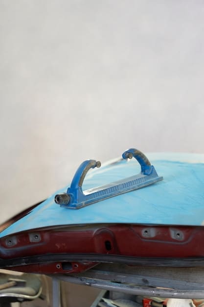 A car parked outdoors with a paint meter device pressed against its hood, capturing the level of gloss retention. The background should be a typical sunny day with light cloud cover.