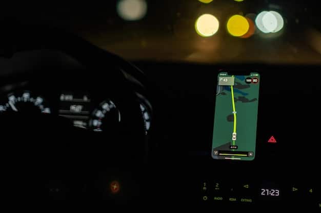 A dashboard of a car, showing a phone displaying a text message with blurry surroundings. The speedometer reads a high speed.
