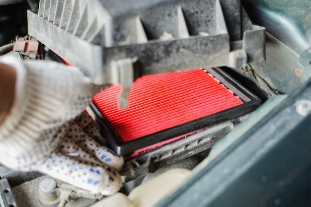Close-up shot of a mechanic carefully covering electrical components and the air intake of an engine with plastic bags, preparing it for cleaning.