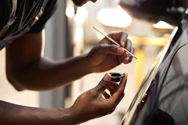 A person using a paint depth gauge on a car door to measure the thickness of the paint layers. The gauge displays a reading in microns.