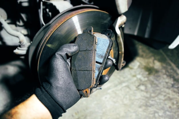 A close-up of a worn brake pad, showing the wear indicator touching the brake rotor. The brake pad material is visibly thin. This image helps visualize what to look for when learning How to Inspect Your Car's Brake Pads for Wear and Tear in Under 30 Minutes (2025 Edition).