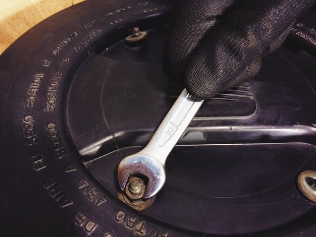 A close-up shot of a person using a torque wrench to tighten lug nuts on a car wheel. The focus is on the precision and accuracy required to ensure the wheel is securely fastened.