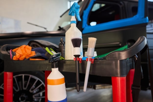 Close-up shot of various car cleaning supplies neatly arranged on a table. Includes car wash soap, microfiber towels, a wash mitt, and a detailing brush. The lighting highlights the textures and cleanliness of the items, emphasizing the importance of quality supplies for DIY car care.