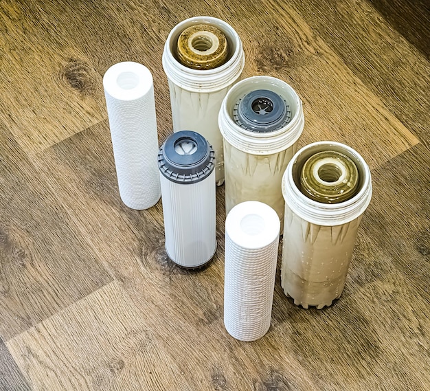 A side-by-side comparison of a brand new, clean air filter and a used, visibly dirty air filter. The clean filter is white or light colored, while the dirty filter is dark with accumulated dust and debris. DIY Air Filter Replacement: Improve Fuel Efficiency by Up to 10% should be mentioned.