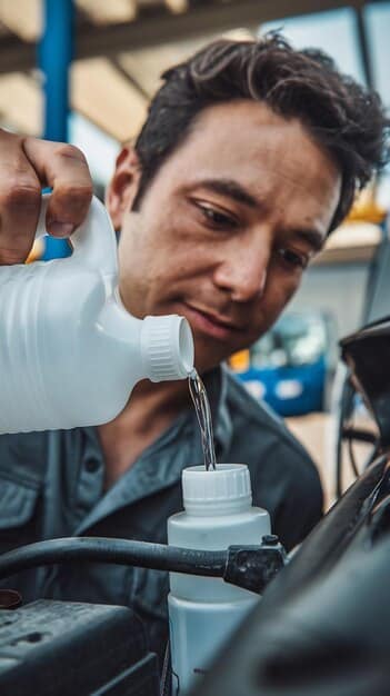 A mechanic is shown checking a car's coolant level. The coolant reservoir is translucent, the fluid level is visible between the 