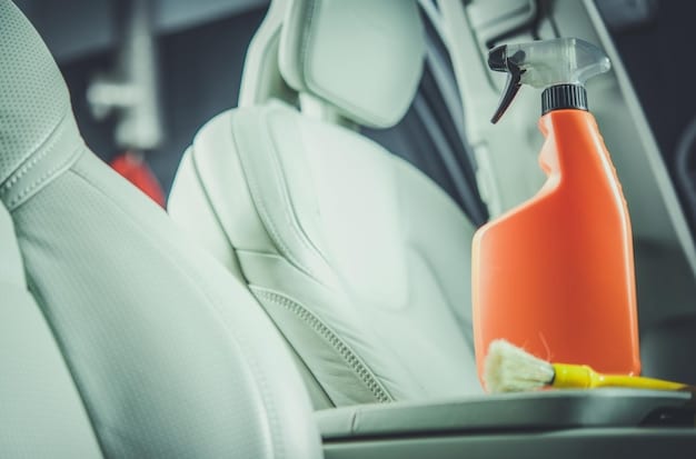 Close-up of cleaning supplies laid out on a car seat, including microfiber cloths, spray bottles with cleaning solutions, and a detailing brush. The focus is on the cleanliness and organization of the materials.