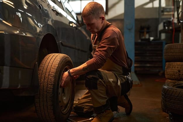 A well-lit image of a car tire being meticulously inspected by a mechanic, with various tools and equipment neatly arranged in the background. Emphasize the depth of field, blurring the background to focus on the tire's tread and sidewall details, relating to Act Now: Get a Free Tire Rotation with Any Oil Change Service Booked Before March 15th.