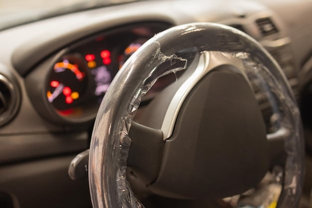 A close-up shot of a car's steering wheel and dashboard. The ignition is visibly damaged, with wires exposed, suggesting forced entry and attempted hot-wiring. The focus is on the damaged components, vividly illustrating the aftermath of a car theft attempt. Reflects themes of increasing theft.