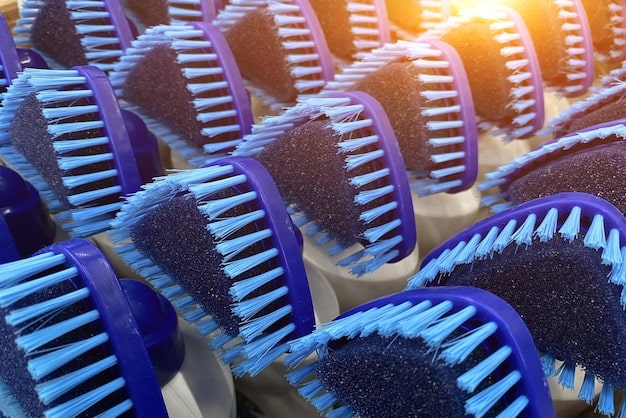 A set of various car detailing brushes laid out on a clean microfiber cloth, showcasing different sizes, shapes, and bristle types. Some brushes have long handles for reaching deep areas, while others are small and compact for intricate detailing, related to 'The 5 Best Car Detailing Brushes for a Spotless Clean in 2025'.