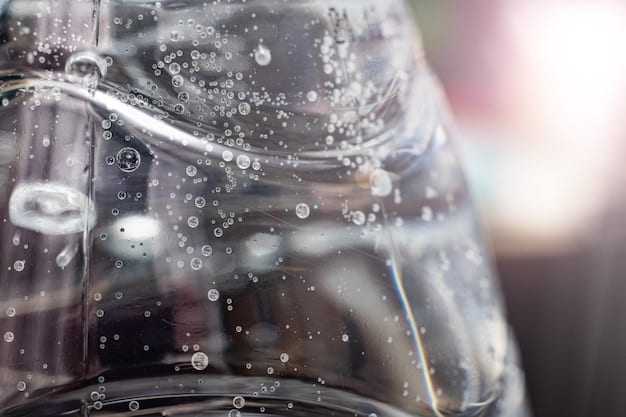A close-up shot of a water recycling system being used at a car wash. The system is filtering and cleaning the used water, and there is a clear display showing the amount of water being saved. In the background, a car is being washed with the recycled water.
