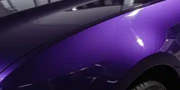 Close-up of a glossy, durable automotive paint finish on a modern US-made car.