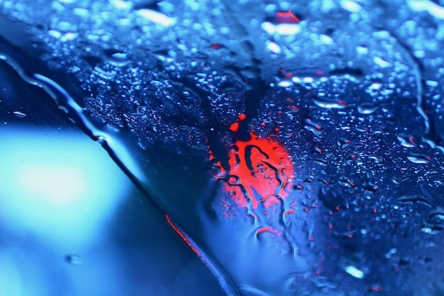 A detailed shot of water beading perfectly on a car's paint surface, showcasing the hydrophobic properties of a high-quality wax or ceramic coating, with a blurred background of a clean garage.