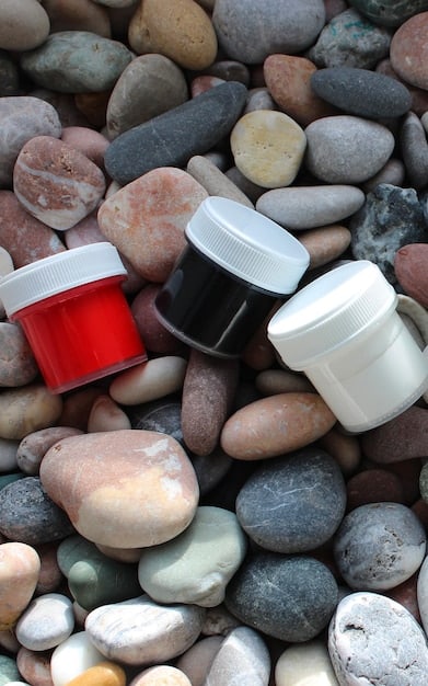 A high-angle shot showcasing a variety of carnauba wax tins and bottles on a clean microfiber towel, illustrating different formulations and packaging.