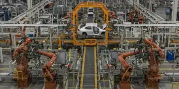 Modern US automotive manufacturing plant with advanced robotics and assembly lines